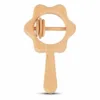 Flower-shaped wooden baby rattle with a smooth handle and sliding rings.