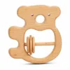 Koala-shaped natural wooden baby rattle with three interactive sliding rings.
