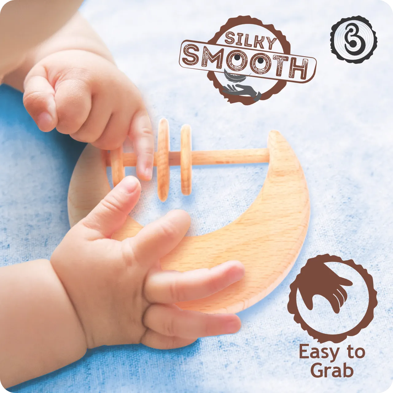 03 (1) Baby's hands grasping a "silky smooth" wooden moon toy.