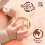 03 (1) Baby’s hands grasping the silky smooth wooden rabbit rattle.
