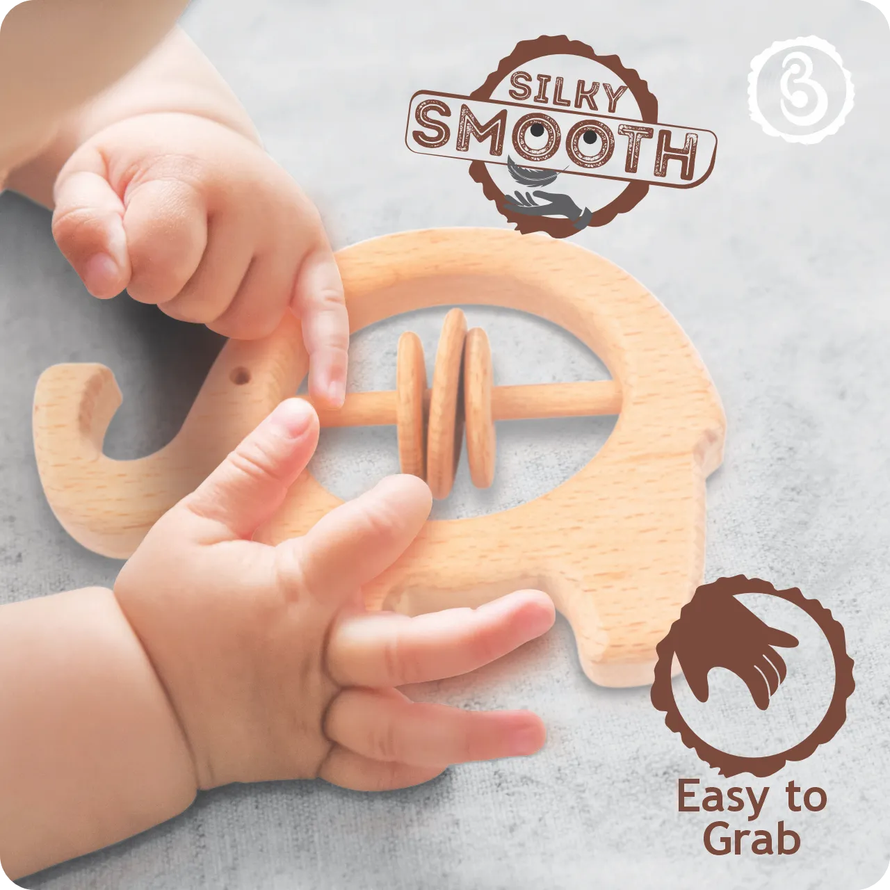 03 Close-up of a baby's hands grasping the silky smooth wooden elephant toy.