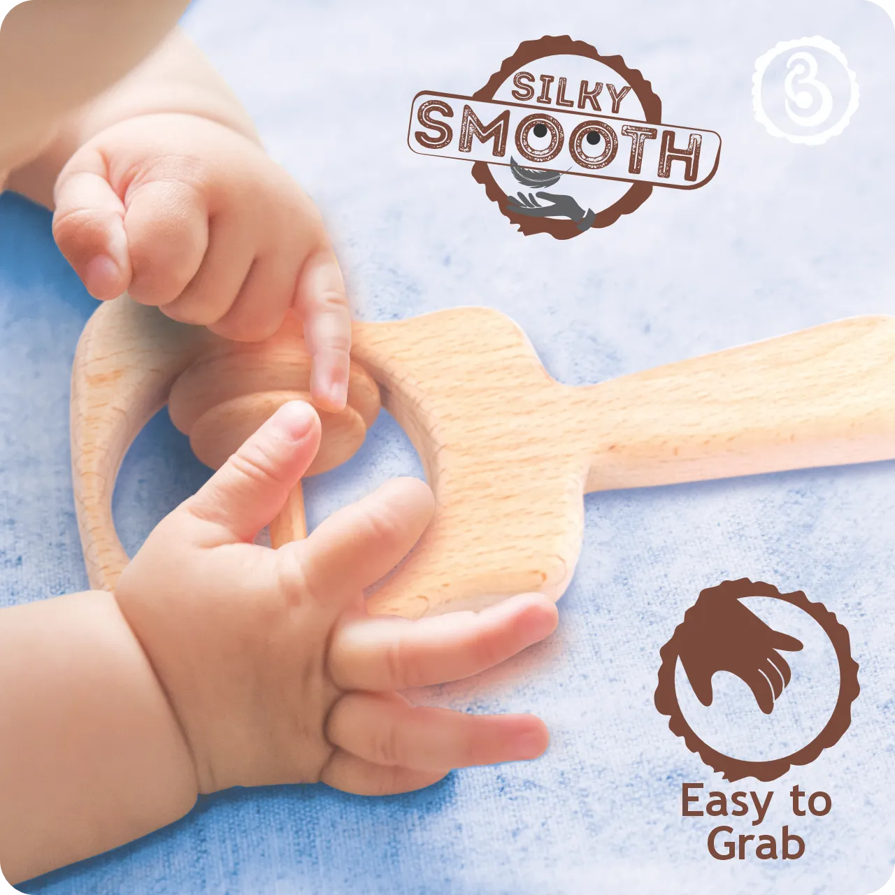 03 Baby’s hands grasping the silky smooth handle of the wooden guitar rattle.