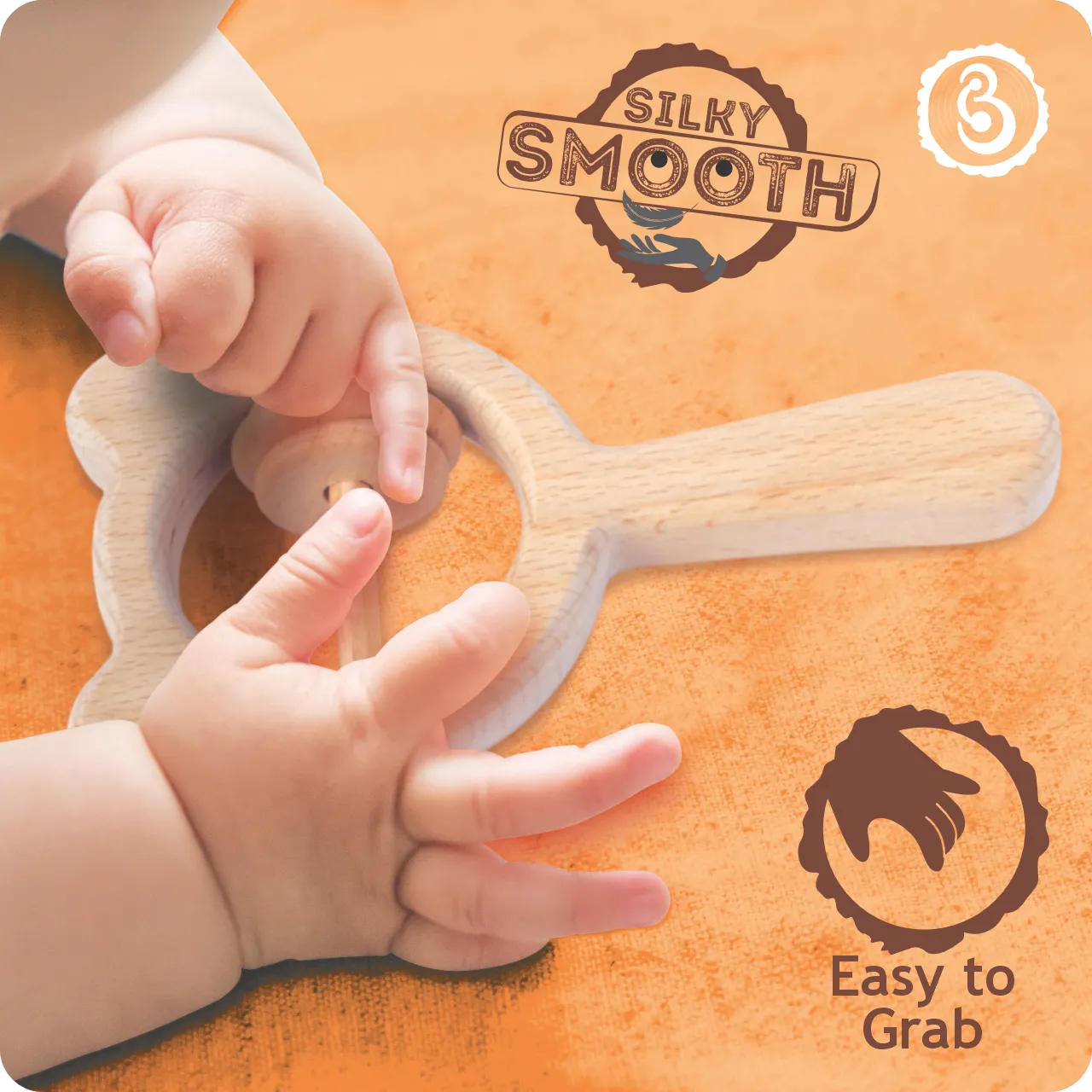 03 Close-up of a baby's hands holding and playing with a wooden rattle.