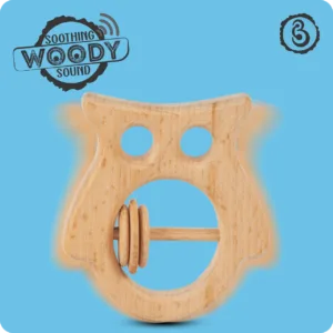 Action shot of a wooden owl rattle illustrating its sound.