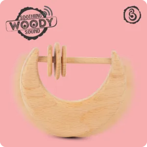 A motion-blurred moon rattle illustrating its soothing natural woody sound.