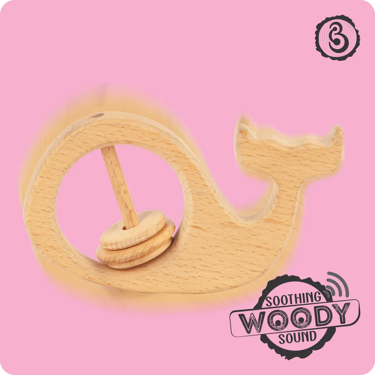 04 Shaking wooden whale baby rattle producing a soothing woody sound on a pink background.