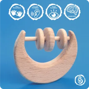 Educational icons detailing how the moon rattle aids fine motor skills and imagination.