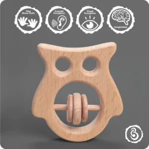 Wooden owl rattle with developmental benefit icons.