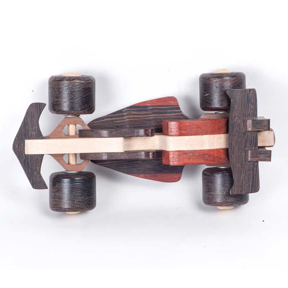 Racercar (12) Top-down flat lay of a handmade wooden race car with contrasting wood grains.