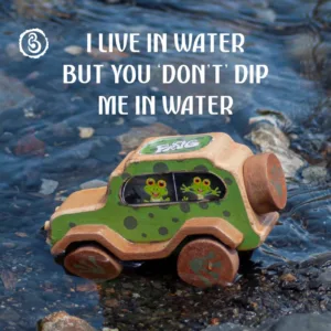 Child's hand on a wooden frog car with a green durability banner.