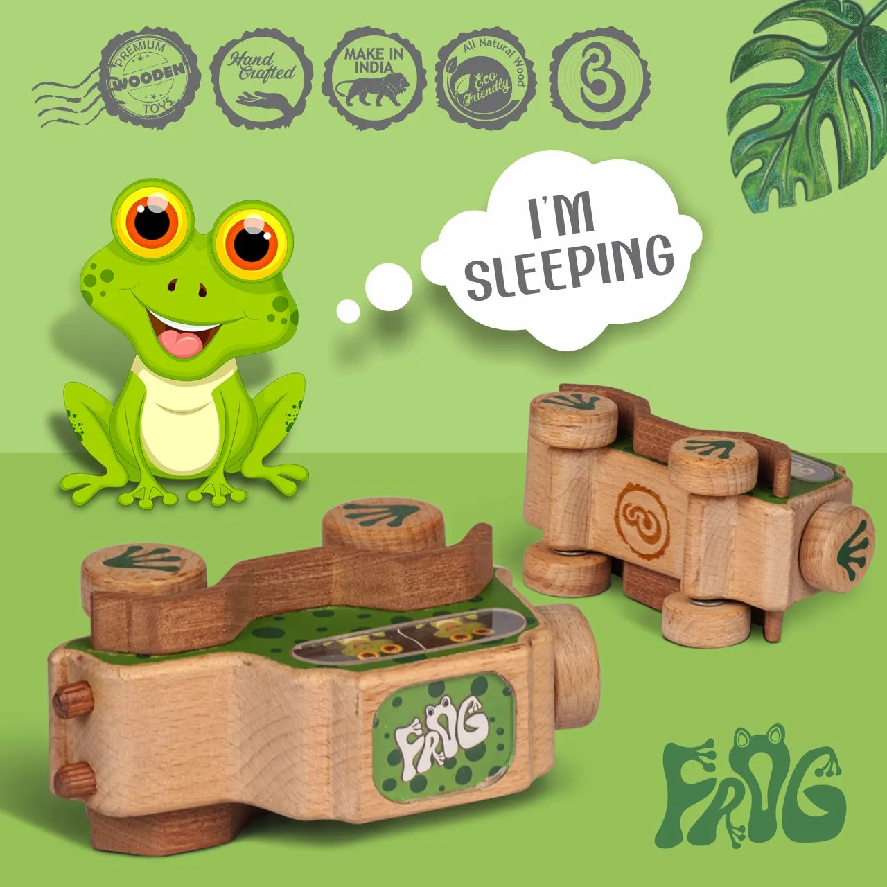 frog 06 Green spotted frog wooden camera toy with paw-print wheels.