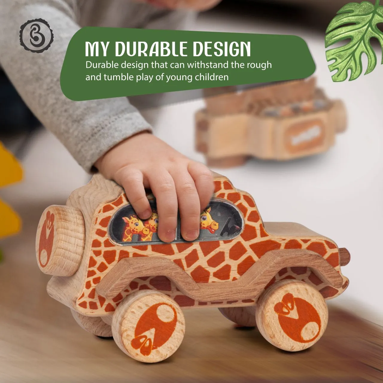 giraffe 03 A child's hand on a giraffe-patterned wooden car, with a green banner about its sturdy build.