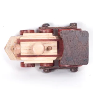 Direct overhead view of a wooden toy locomotive showing the boiler and cabin.