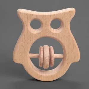 Front view of a handcrafted owl-shaped wooden baby rattle on a gray background.