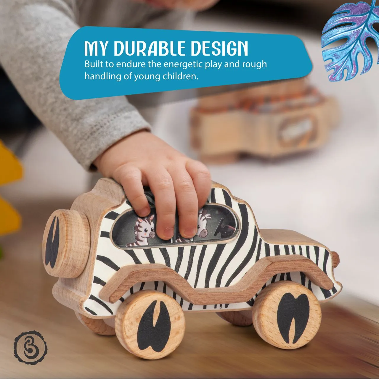 zebra 03 A child's hand gripping a wooden zebra toy car, with text highlighting its build for rough handling.