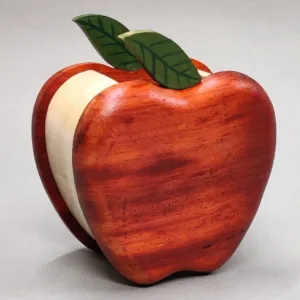 Three-quarter view of a red wooden apple storage container.