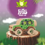 frog_front A frog-themed wooden animal car displayed on a tree stump with a playful illustrated background.