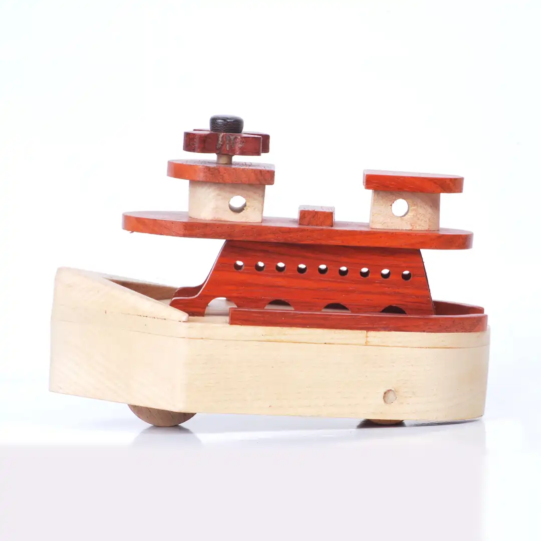 ship01 Side profile of a two-tone wooden toy ship with a red deck.