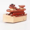 High-angle side view of a wooden toy ship showing deck levels.