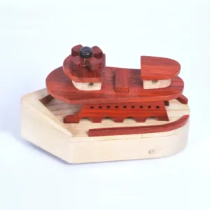 Top-down perspective of a wooden toy ship with red deck plates.