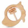 Front view of a natural wood mango-shaped baby rattle with three jingling rings.