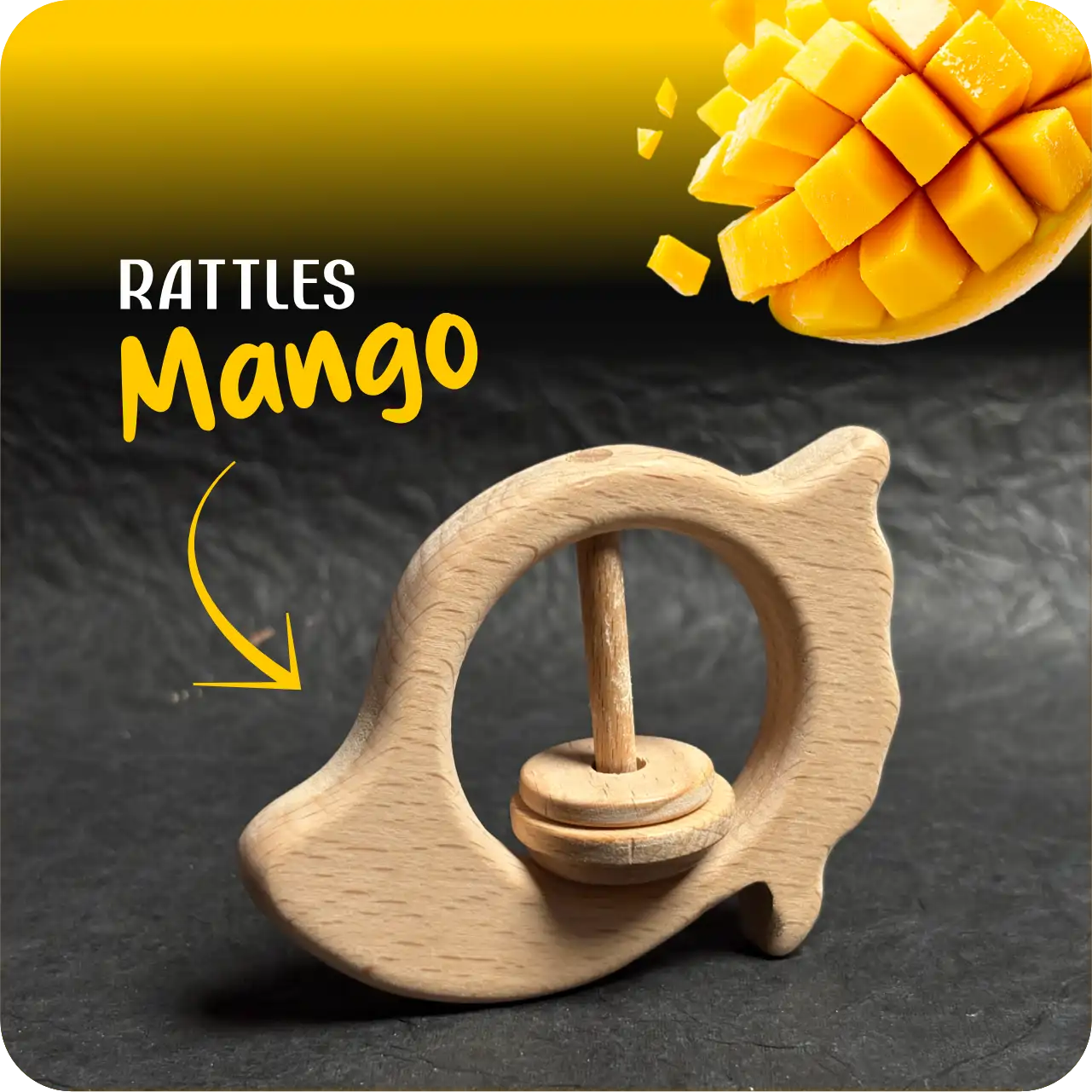mango_name Mango-shaped natural wooden baby rattle with a single sliding ring on a textured dark background.