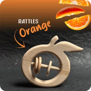 Natural wooden orange-shaped baby rattle with sliding rings on a dark textured background.