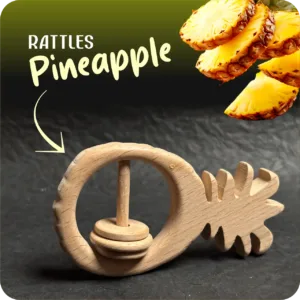 Natural wooden pineapple-shaped baby rattle with sliding rings on a dark textured background.
