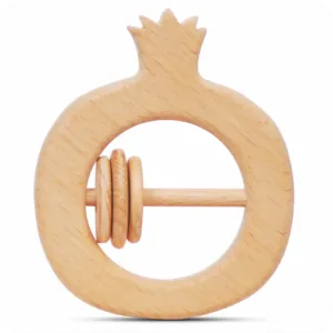 Front view of a natural wood pomegranate-shaped baby rattle with a smooth crown detail.