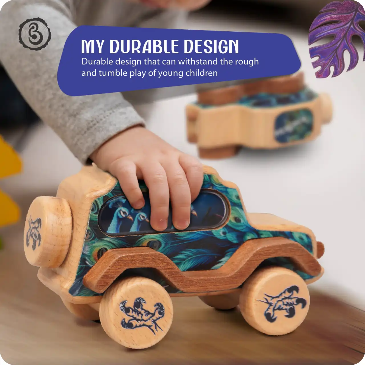 peacock04 A child's hand playing with the wooden peacock car, demonstrating its sturdy construction.