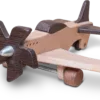 Close-up of a wooden aeroplane with a metallic propeller hub and dark accents.