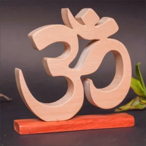 Handcrafted wooden Om symbol on a display stand