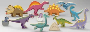 Wooden dinosaur toys arranged in a desert scene.